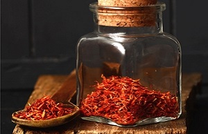 saffron flower and a pot of saffron threads