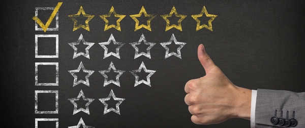 Blackboard with white and yellow stars representing quality and trust